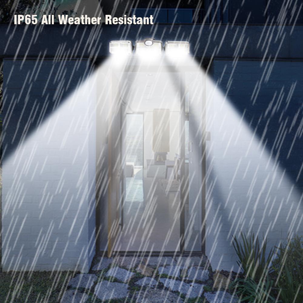 A highly lit door showing the IP65 security light above in intense rainfall