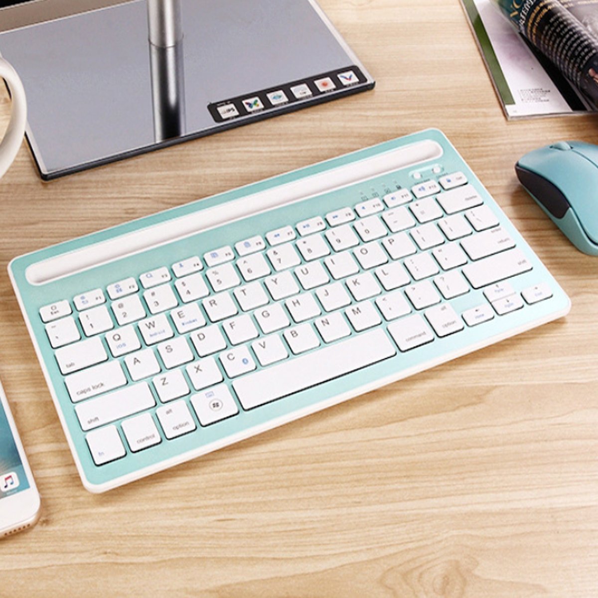 A Multi-Task Master Of All Bluetooth Keyboard shown in teal green and white color