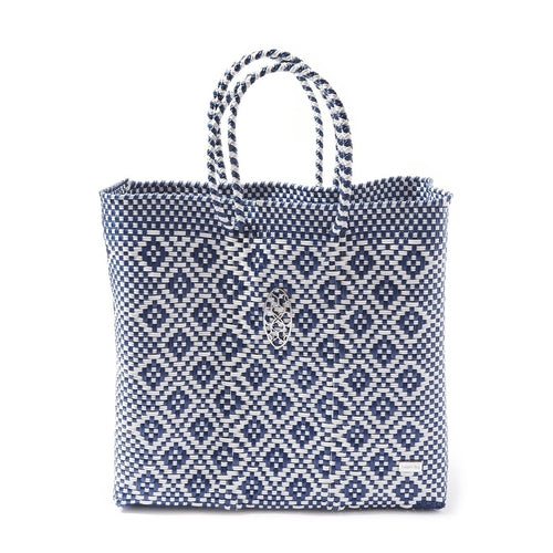 A MEDIUM BLUE AZTEC TOTE BAG in white with blue diamond emblems