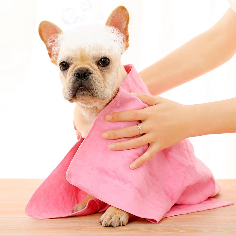 26x17 Large Pet Towel-Water Absorber in pink shown wrapped around a wet tan pug puppie with suds on his head