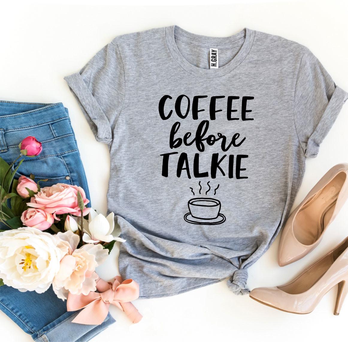 Coffee Before Talkie T-shirt shown in grey with a set of jeans and high heels and roses sitting next to it