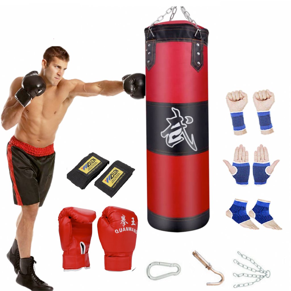 A Boxing Trainer Fitness Punching Bag Set shown with a male model shown striking the heavy bag with various included items sitting around the bag such as red gloves wrist wraps and carabiners for hanging the bag