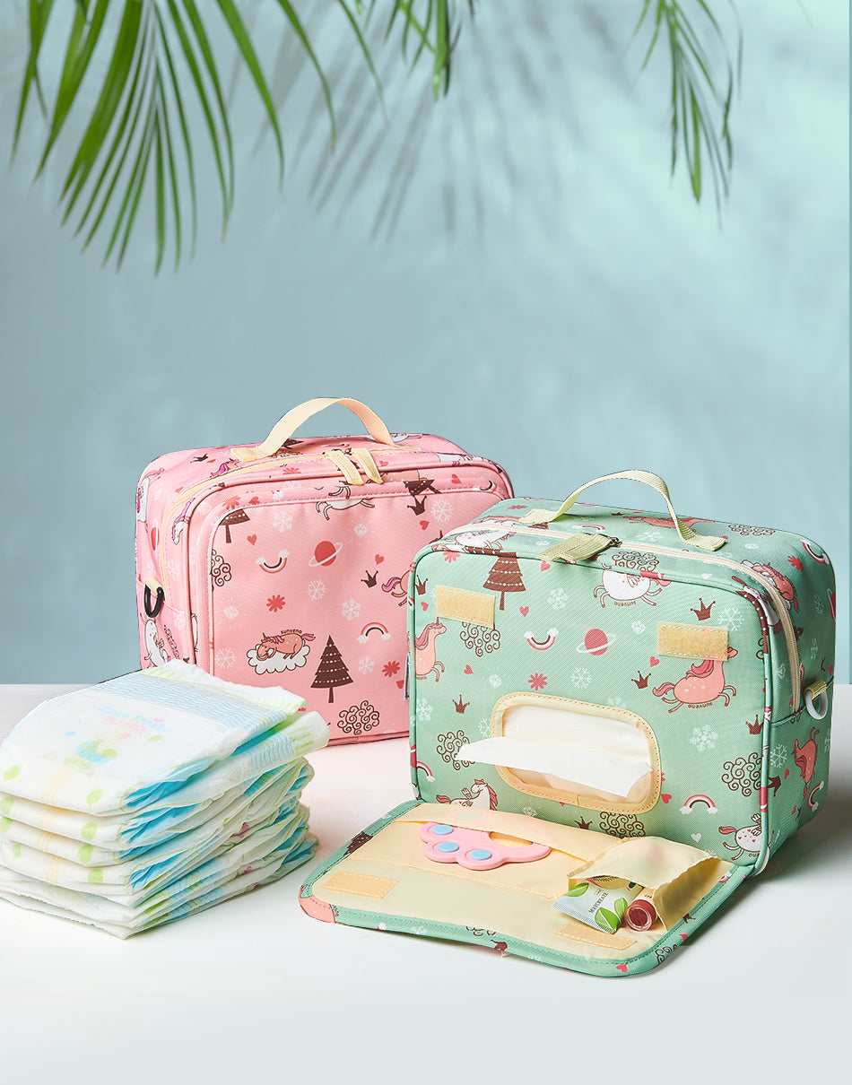 A Nappy Waterproof Diaper Changing Bag shown in pink with decoration and teal green with decorations on it