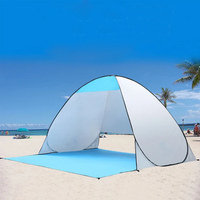 Thumbnail for An Automatic Easy Outdoor Tent shown sitting on the beach in blue and white