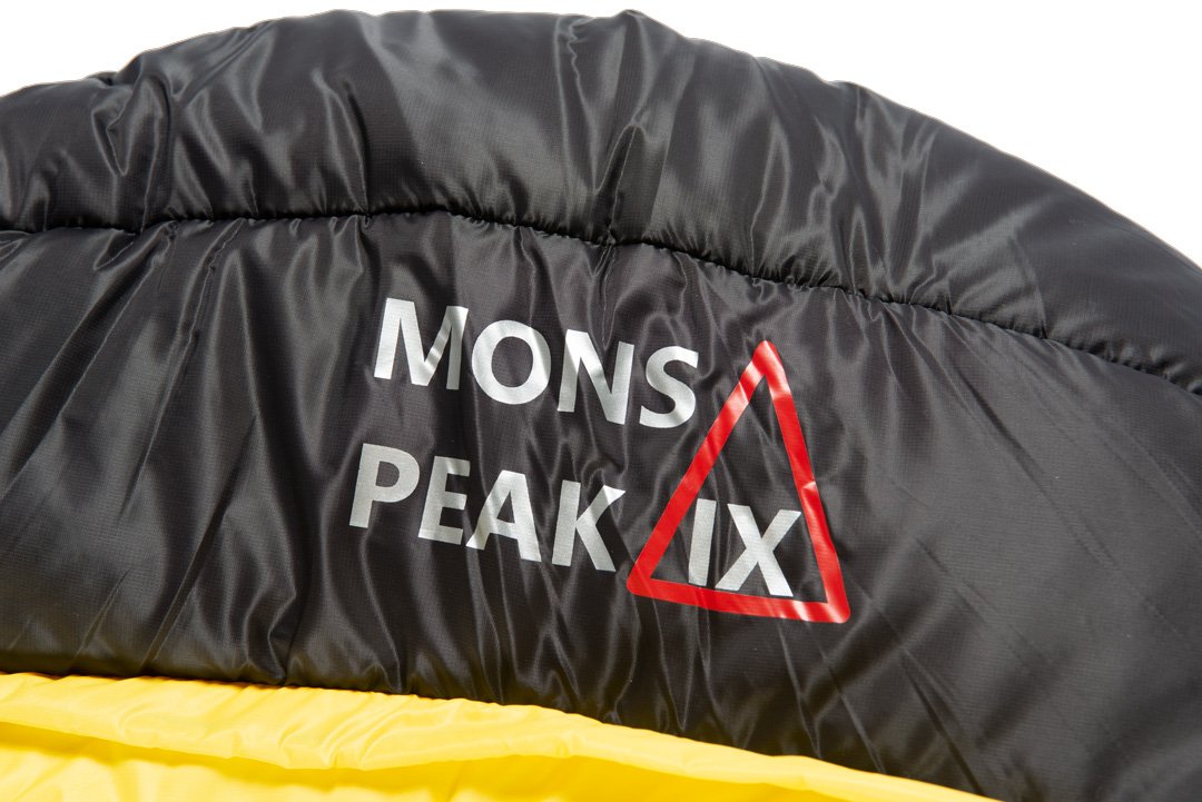 The brand Mons Peak IX displayed on the underside of the sleeping bag