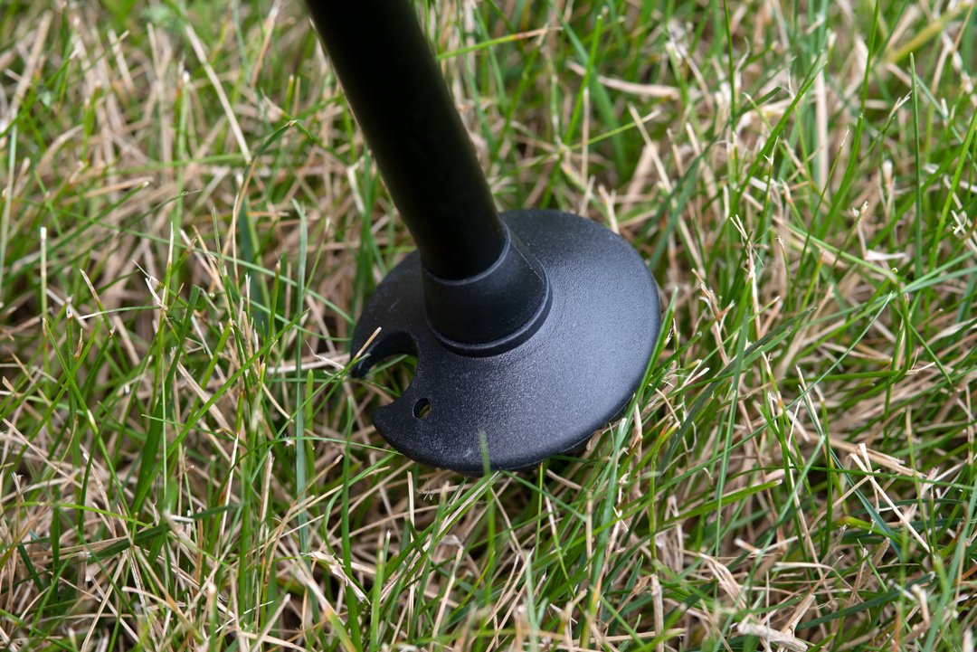 Trekking Poles Mud Snow Baskets, (4-Pack) being used in mushy grass