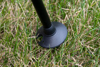 Thumbnail for Trekking Poles Mud Snow Baskets, (4-Pack) being used in mushy grass