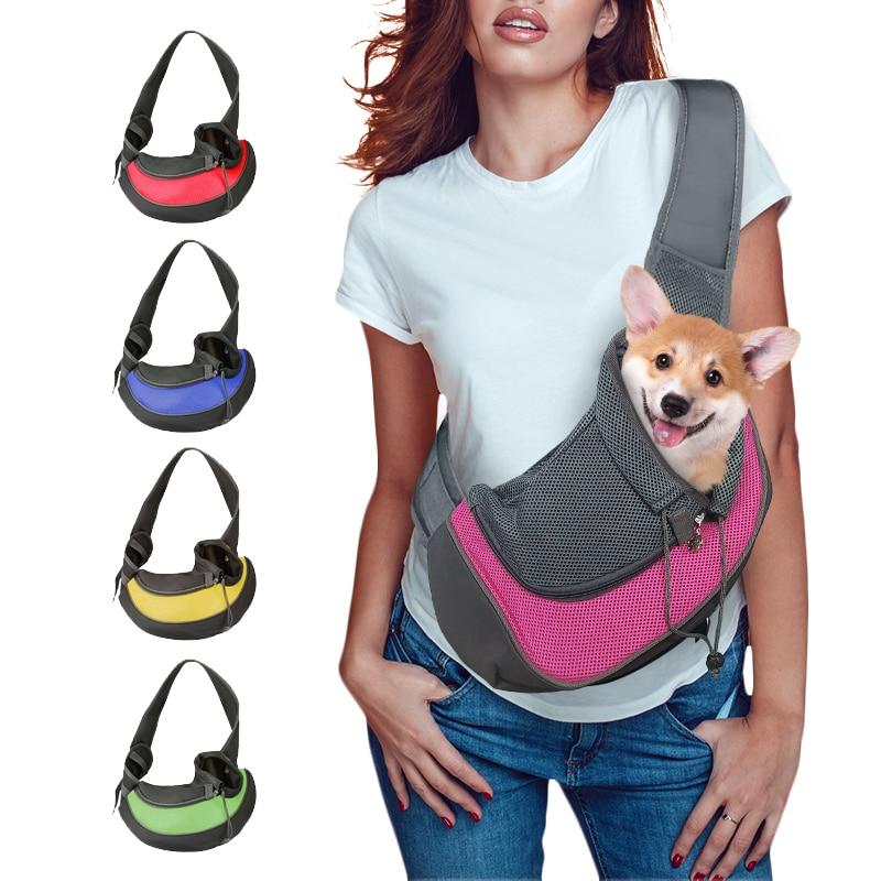 Female model shown using Comfy Puppy & Kitten Travel Shoulder Bag with a tan and white corgy pupy riding within it also various color variation are shown next to it red blue yellow and green