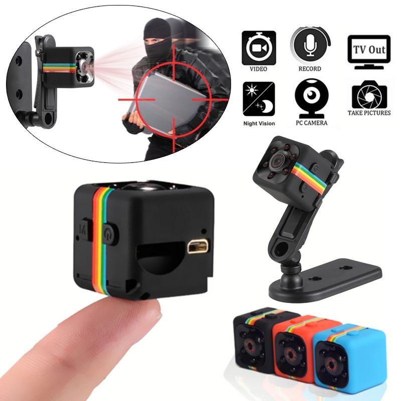 Shows various features of the Night Vision 1080P Portable Mini Camera and shows it sitting on a stand