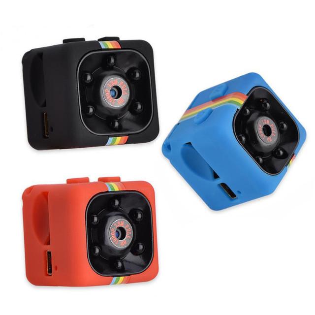 Shows three Night Vision 1080P Portable Mini Camera one in black with rainbow stripe one in blue with rainbow stripe and the other in orange with a rainbow stripe